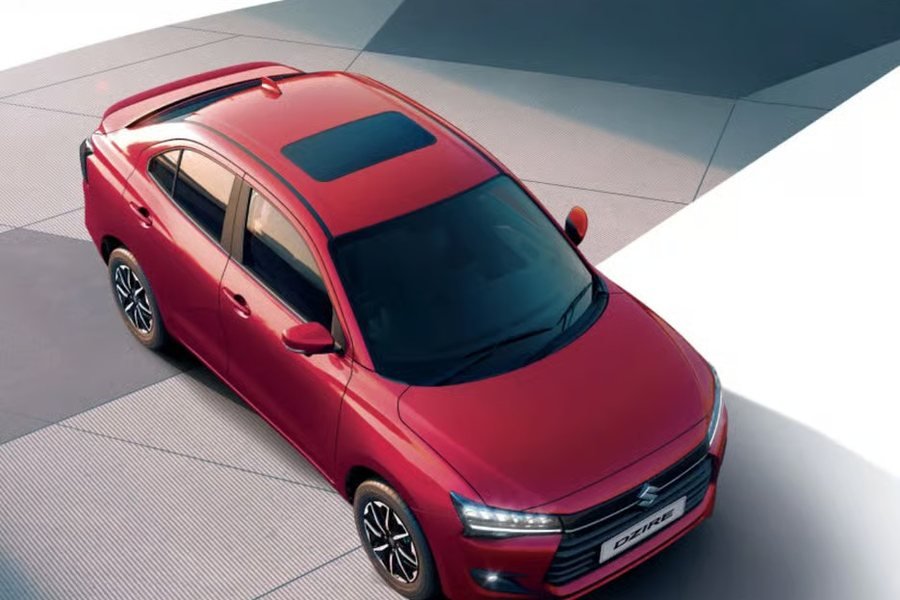 Red Maruti Dzire top model with sunroof for hire in Mangalore