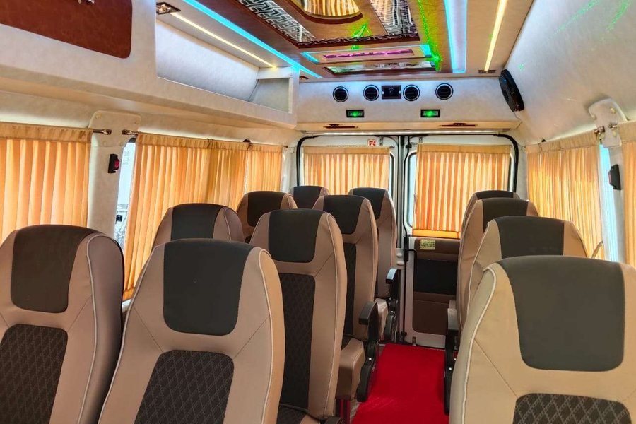 Push-back seating inside a tempo traveller hired in Mangalore